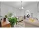 Inviting living room with arched window, plush seating, and a bright, airy ambiance, perfect for relaxation or entertaining guests at 4865 Gorham Ave, Orlando, FL 32817