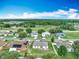 An aerial view of the neighborhood, showcasing the nearby pond and surrounding homes at 5125 Pine Needle Dr, Mascotte, FL 34753