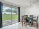Dining area featuring sliding glass doors leading to the backyard at 5125 Pine Needle Dr, Mascotte, FL 34753