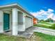 Home's front exterior features a side entry garage, a neatly kept yard, and an inviting entrance at 5125 Pine Needle Dr, Mascotte, FL 34753
