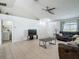 Open living room featuring tile flooring, a ceiling fan, and comfortable seating at 5125 Pine Needle Dr, Mascotte, FL 34753