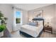 Cozy bedroom with bright window and lamps on nightstands on each side of the bed at 5162 Masser Rd, St Cloud, FL 34772