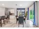 Inviting dining area next to kitchen featuring a table with six chairs, and sliding glass doors at 5162 Masser Rd, St Cloud, FL 34772