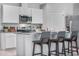 Modern kitchen featuring white cabinets and stainless steel appliances, offering a clean and efficient cooking space at 5162 Masser Rd, St Cloud, FL 34772