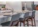 Spacious kitchen island with bar stools, perfect for casual dining and entertaining guests in a modern home at 5162 Masser Rd, St Cloud, FL 34772