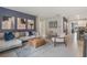 Spacious living room featuring a plush sectional sofa, modern decor, and stylish furnishings at 5162 Masser Rd, St Cloud, FL 34772