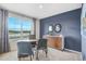 Modern office featuring a large window and a beautiful accent wall, perfect for a productive work environment at 5162 Masser Rd, St Cloud, FL 34772