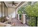 Enjoy nature on the balcony with nice seating and black railing and beautiful nature views at 617 Canopy Estates Dr, Winter Garden, FL 34787