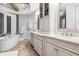 Upscale bathroom with a soaking tub, dual sinks, and mosaic tile accents at 617 Canopy Estates Dr, Winter Garden, FL 34787