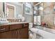 Well-lit bathroom features a shower/tub combo, a vanity, a large mirror, and decorative towels at 617 Canopy Estates Dr, Winter Garden, FL 34787