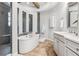 Luxurious bathroom featuring a soaking tub, walk-in shower, and elegant tile work at 617 Canopy Estates Dr, Winter Garden, FL 34787