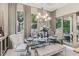 Elegant dining room with glass table, stylish chairs, and natural light at 617 Canopy Estates Dr, Winter Garden, FL 34787