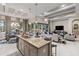 Modern kitchen island offering seating and prep space, seamlessly connecting to the adjacent living area at 617 Canopy Estates Dr, Winter Garden, FL 34787