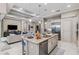 Open concept kitchen with center island, stainless appliances and view to the living room at 617 Canopy Estates Dr, Winter Garden, FL 34787