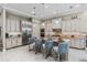 Spacious modern kitchen with stainless steel appliances, an island with seating, and ample cabinet space at 617 Canopy Estates Dr, Winter Garden, FL 34787