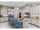 Well-equipped kitchen with stainless steel appliances, a large center island, and modern fixtures at 617 Canopy Estates Dr, Winter Garden, FL 34787