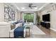 Open-concept living room with a comfortable white sectional, modern decor, and natural light at 617 Canopy Estates Dr, Winter Garden, FL 34787