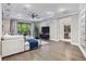 Bright living room with stylish decor, recessed lighting, and elegant hardwood floors at 617 Canopy Estates Dr, Winter Garden, FL 34787