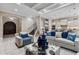 Open living room showing the kitchen, modern decor, and staircase at 617 Canopy Estates Dr, Winter Garden, FL 34787