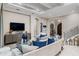 Comfortable living room showcasing a modern decor, TV, and staircase at 617 Canopy Estates Dr, Winter Garden, FL 34787