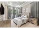 Serene main bedroom featuring a large window and tray ceiling at 617 Canopy Estates Dr, Winter Garden, FL 34787