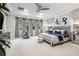 Spacious main bedroom with plush carpet, a sitting area, and large windows at 617 Canopy Estates Dr, Winter Garden, FL 34787