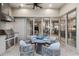 Covered outdoor patio featuring grill and a dining area with seating for four at 617 Canopy Estates Dr, Winter Garden, FL 34787