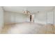 A spacious bedroom featuring tile flooring, ceiling fan, and neutral-colored walls at 624 American Heritage Pkwy, Orlando, FL 32809