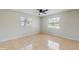Bright bedroom with tile flooring, natural light, and a ceiling fan at 624 American Heritage Pkwy, Orlando, FL 32809