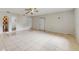 Bright, spacious living room with tile floors and a ceiling fan offers space for flexible arrangements at 624 American Heritage Pkwy, Orlando, FL 32809