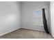 Neutral bedroom featuring a window with blinds and carpeted flooring at 631 Lady Diana Dr, Davenport, FL 33837