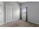 Comfortable bedroom with a window, plush carpeting, and closet at 631 Lady Diana Dr, Davenport, FL 33837