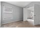 Carpeted bedroom with a window and a doorway to another room at 631 Lady Diana Dr, Davenport, FL 33837