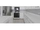 Well-maintained kitchen with white cabinets, stainless steel appliances, and tile flooring at 631 Lady Diana Dr, Davenport, FL 33837