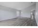 Bright living room featuring sleek gray floors, vaulted ceilings, and plenty of natural light at 631 Lady Diana Dr, Davenport, FL 33837