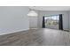 Inviting living room featuring sleek gray floors, vaulted ceilings, a large window, and neutral paint at 631 Lady Diana Dr, Davenport, FL 33837