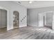 Spacious main bedroom with neutral paint, wood-look flooring, and en-suite bathroom at 631 Lady Diana Dr, Davenport, FL 33837