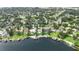 An aerial view of lakefront homes in a residential community with mature trees and well-maintained lawns at 7145 Lake Dr, Orlando, FL 32809