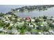 Neighborhood aerial view featuring a lakefront property with mature trees and well-maintained landscaping at 7145 Lake Dr, Orlando, FL 32809