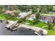 Waterfront property with boat docks, pools, lush landscaping, and a tranquil view of the lake at 7145 Lake Dr, Orlando, FL 32809