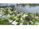 Aerial view features home with access to a lake, lush landscaping and mature trees at 7145 Lake Dr, Orlando, FL 32809