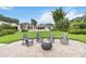 Spacious backyard featuring a lush lawn, tropical greenery, and outdoor seating, perfect for entertaining guests at 7145 Lake Dr, Orlando, FL 32809