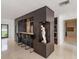 Stylish bar area features sleek design, seating, and convenient access to kitchen appliances at 7145 Lake Dr, Orlando, FL 32809