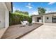 A backyard deck with outdoor seating and tropical landscaping for relaxation and entertainment at 7145 Lake Dr, Orlando, FL 32809