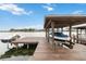 Boat dock with covered boat slip, offering convenient access to water activities at 7145 Lake Dr, Orlando, FL 32809