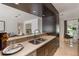 Contemporary kitchen with stainless steel sink, sleek cabinets, and breakfast bar for casual dining at 7145 Lake Dr, Orlando, FL 32809