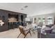 Spacious living room with bar, modern finishes, travertine floors, and water views at 7145 Lake Dr, Orlando, FL 32809