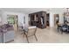 Open living space combines living, dining, and kitchen, with modern décor and travertine flooring at 7145 Lake Dr, Orlando, FL 32809