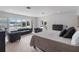 Bright main bedroom offers plenty of natural light, comfortable seating, and views of the water at 7145 Lake Dr, Orlando, FL 32809