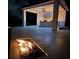 Cozy outdoor kitchen area with modern appliances and ambient lighting for nighttime entertainment at 7145 Lake Dr, Orlando, FL 32809